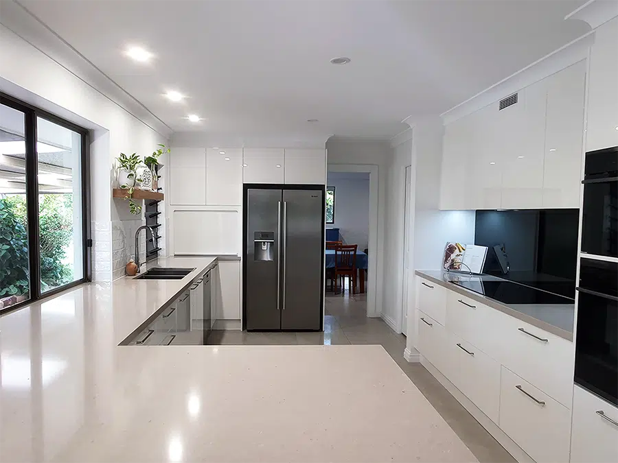 Renovated kitchen with stone benchtop and stainless steel appliances, Sunshine Coast kitchen renovation by TJS Build Groups